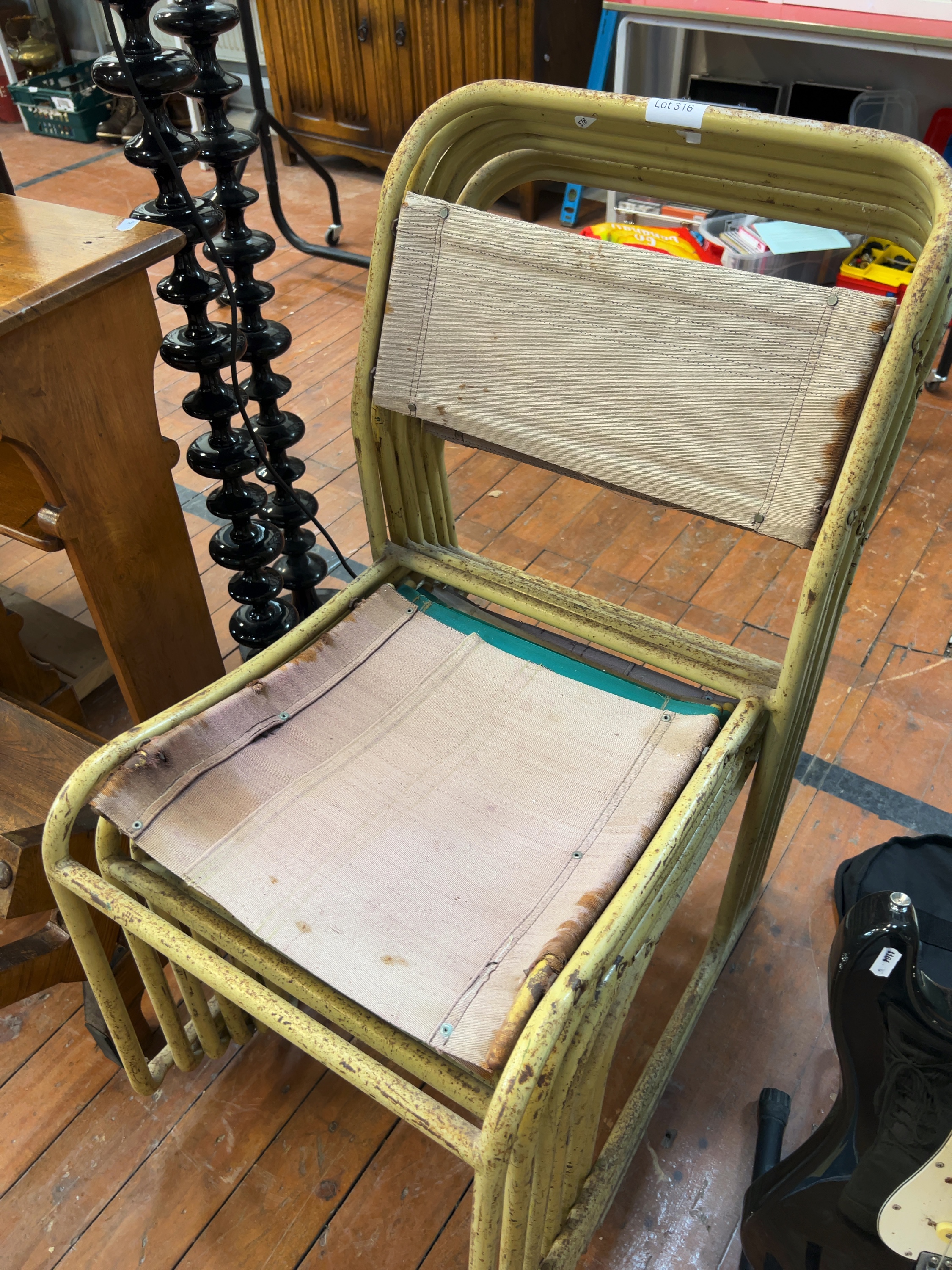 A Set of six Mid-Century Industrial Tubular Steel Stacking Chairs