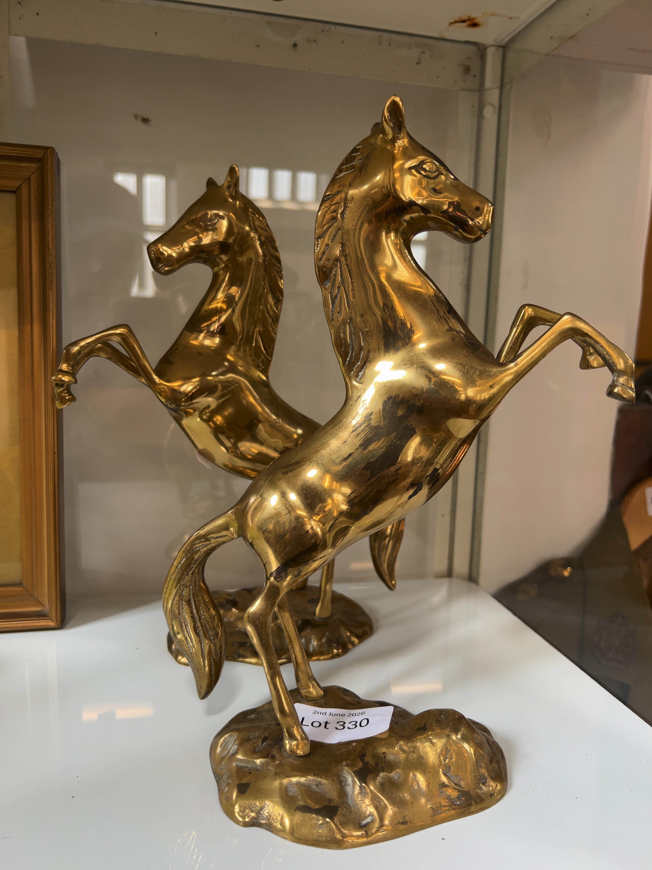 A Pair of Vintage Polished Brass Rearing Horse Sculptures