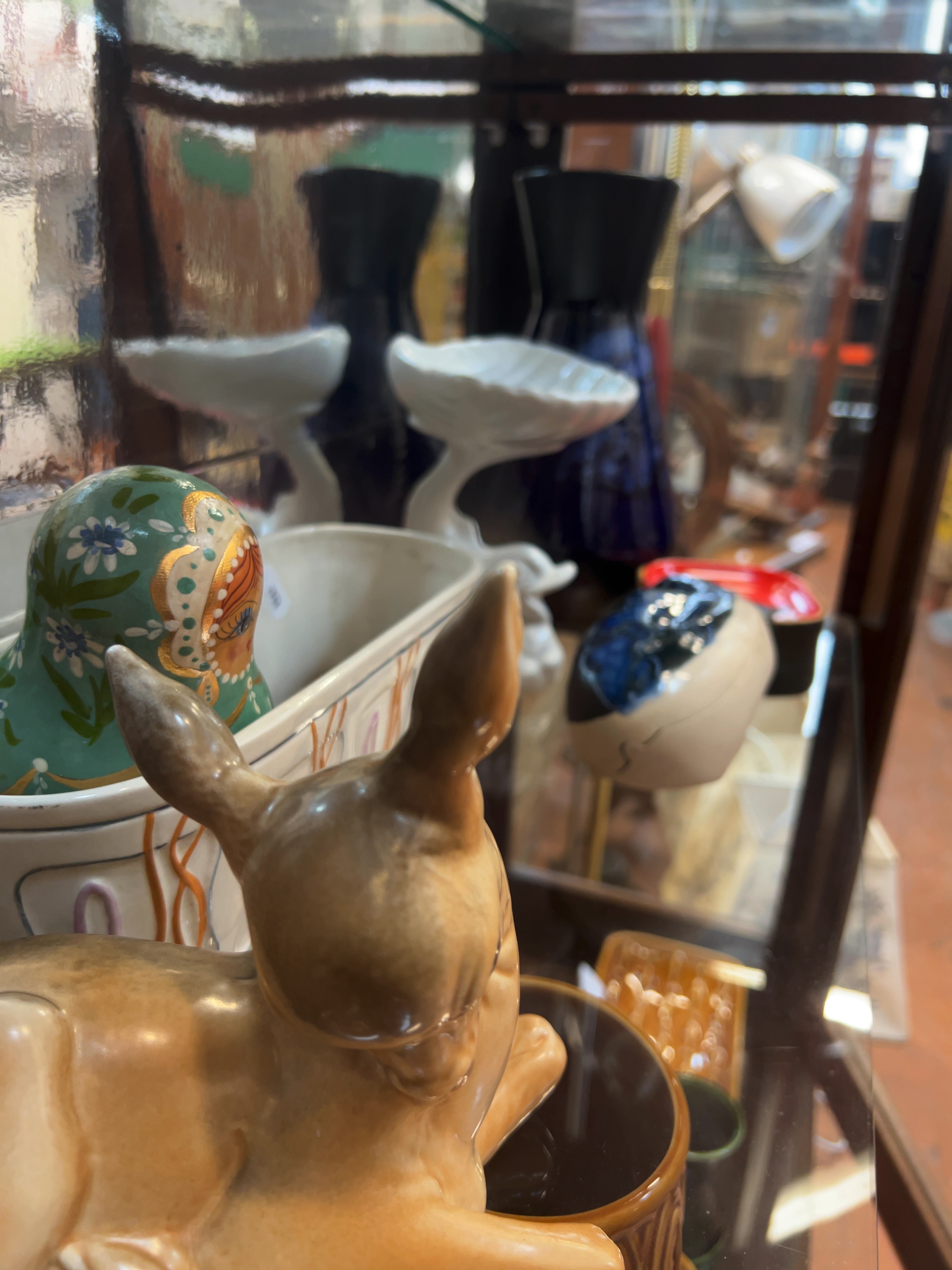 An Assortment of Mid-20th Century Style Decorative Ceramics and a Traditional Nesting Doll