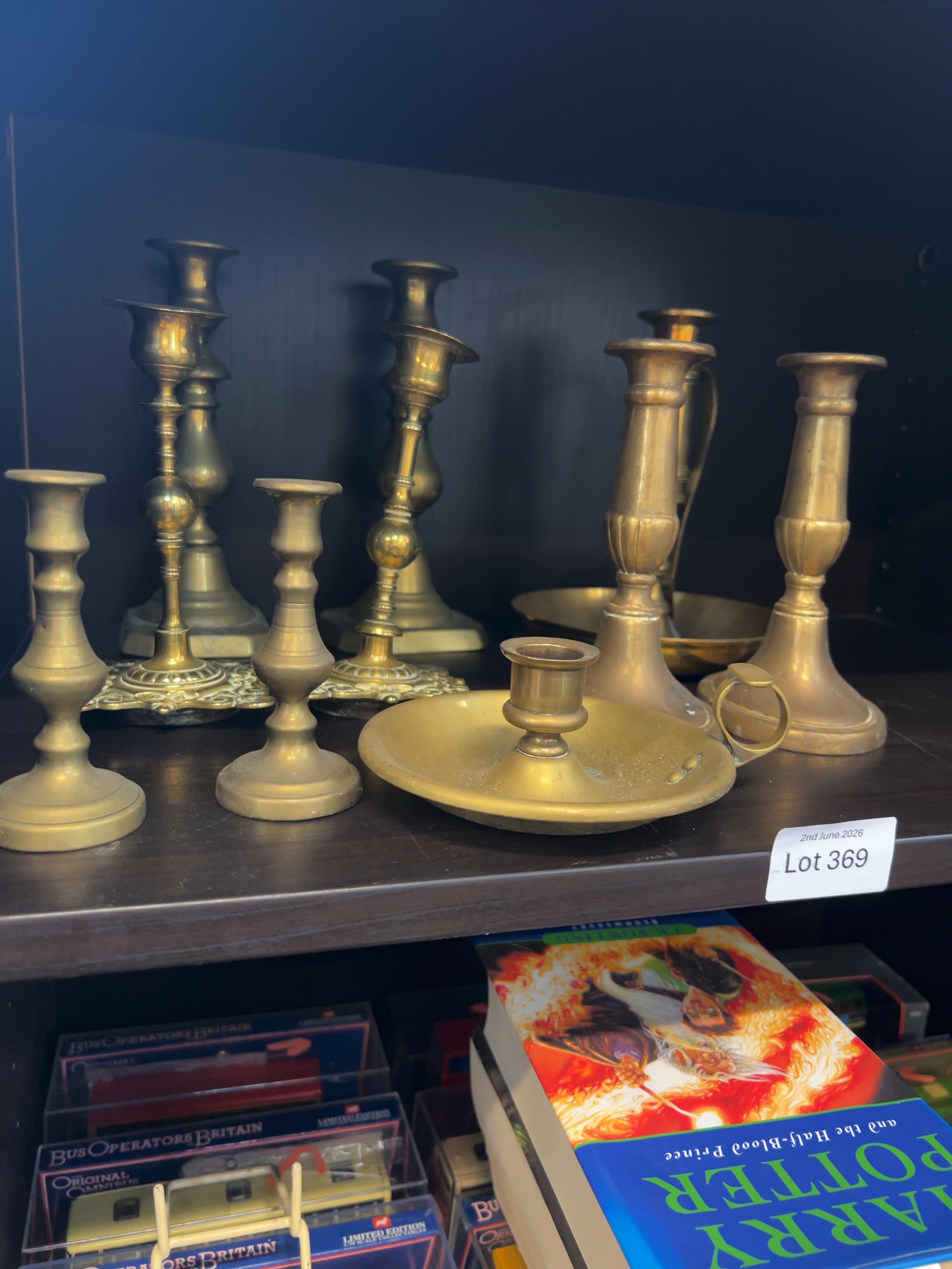 A Collection of Assorted Brass Candlesticks and Chambersticks