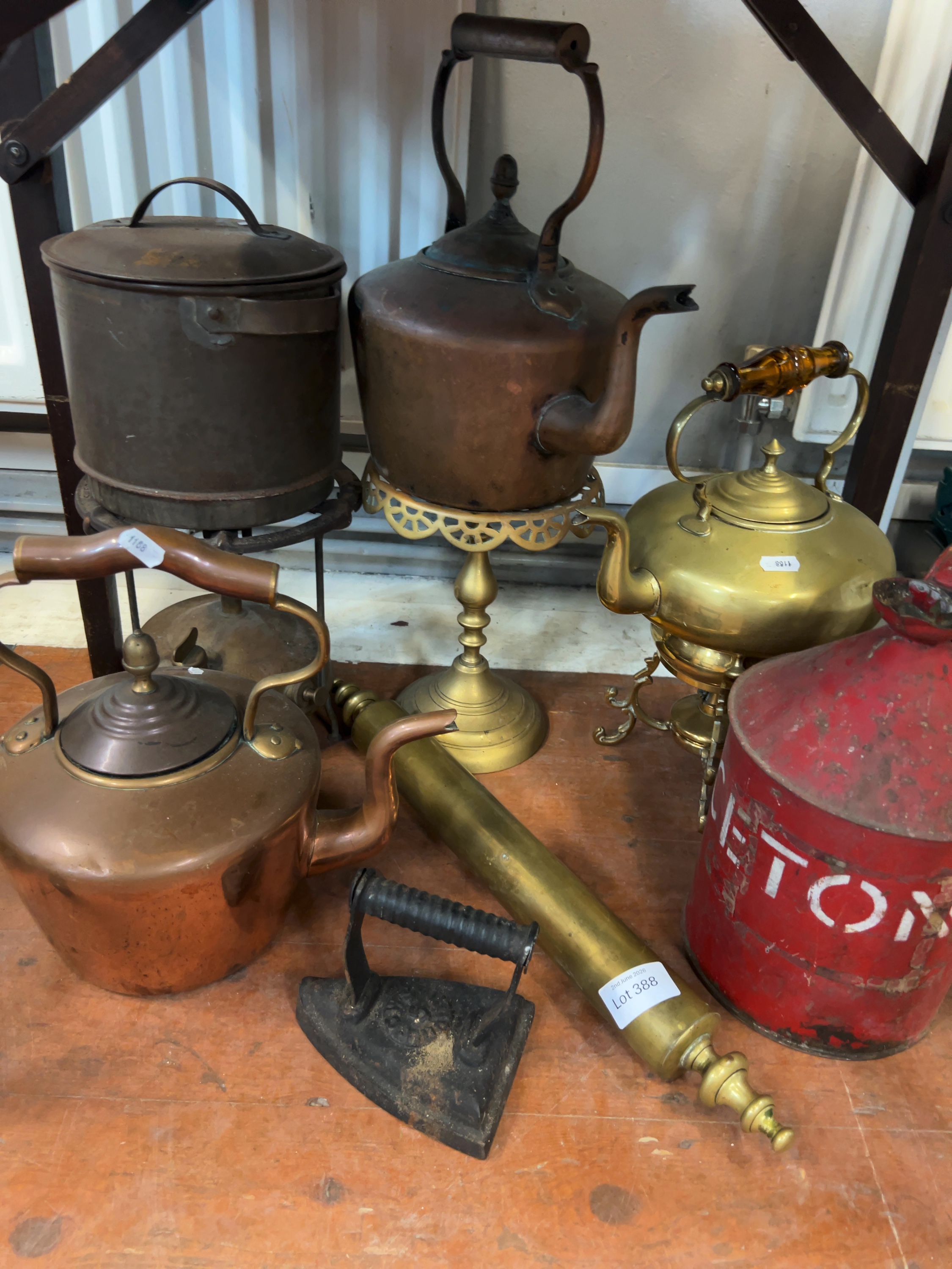 A Collection of Victorian and Early 20th Century Metalware including Copper and Brass Kettles, a Garden Syringe, and a Sad Iron