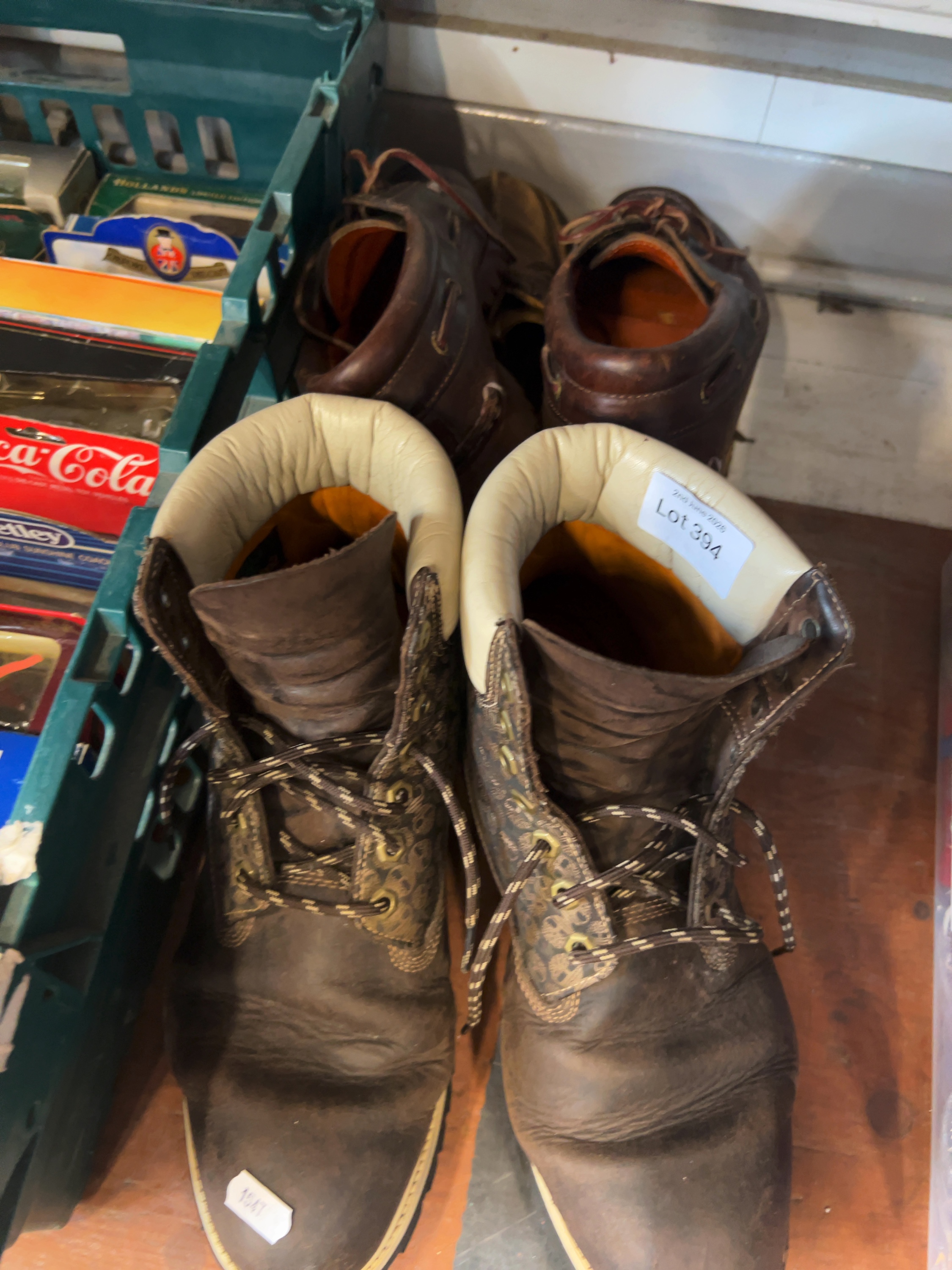 A Pair of Timberland Brown Leather and Monogram Fabric Lace-Up Boots