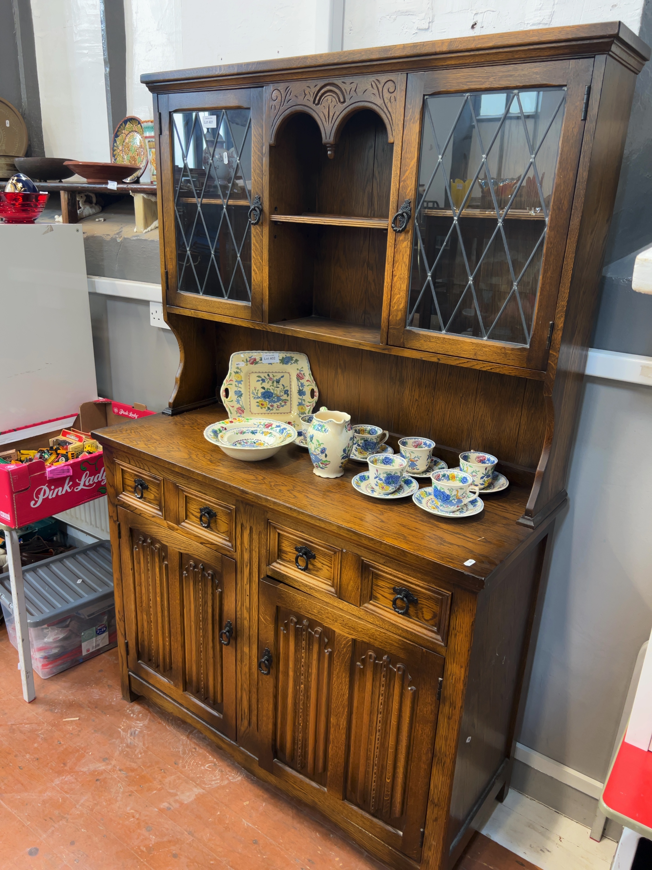 A Late 20th Century Tudor Style Stained Oak Welsh Dresser in the style of Wood Bros Old Charm