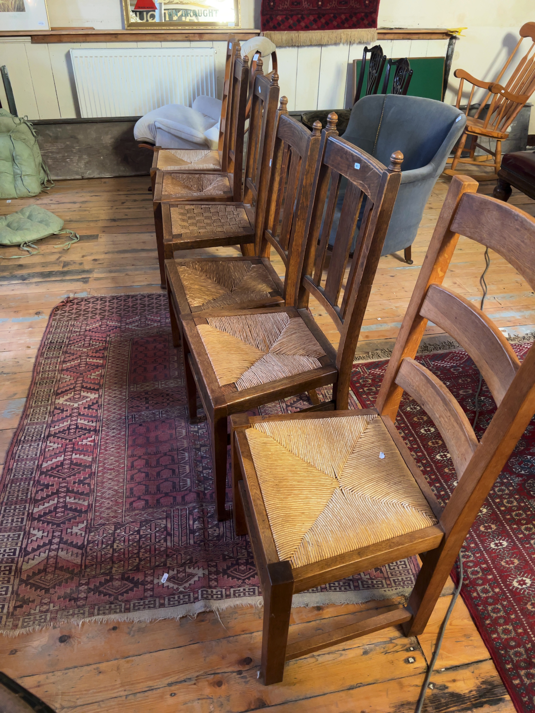 A set of five Arts and Crafts oak dining chairs