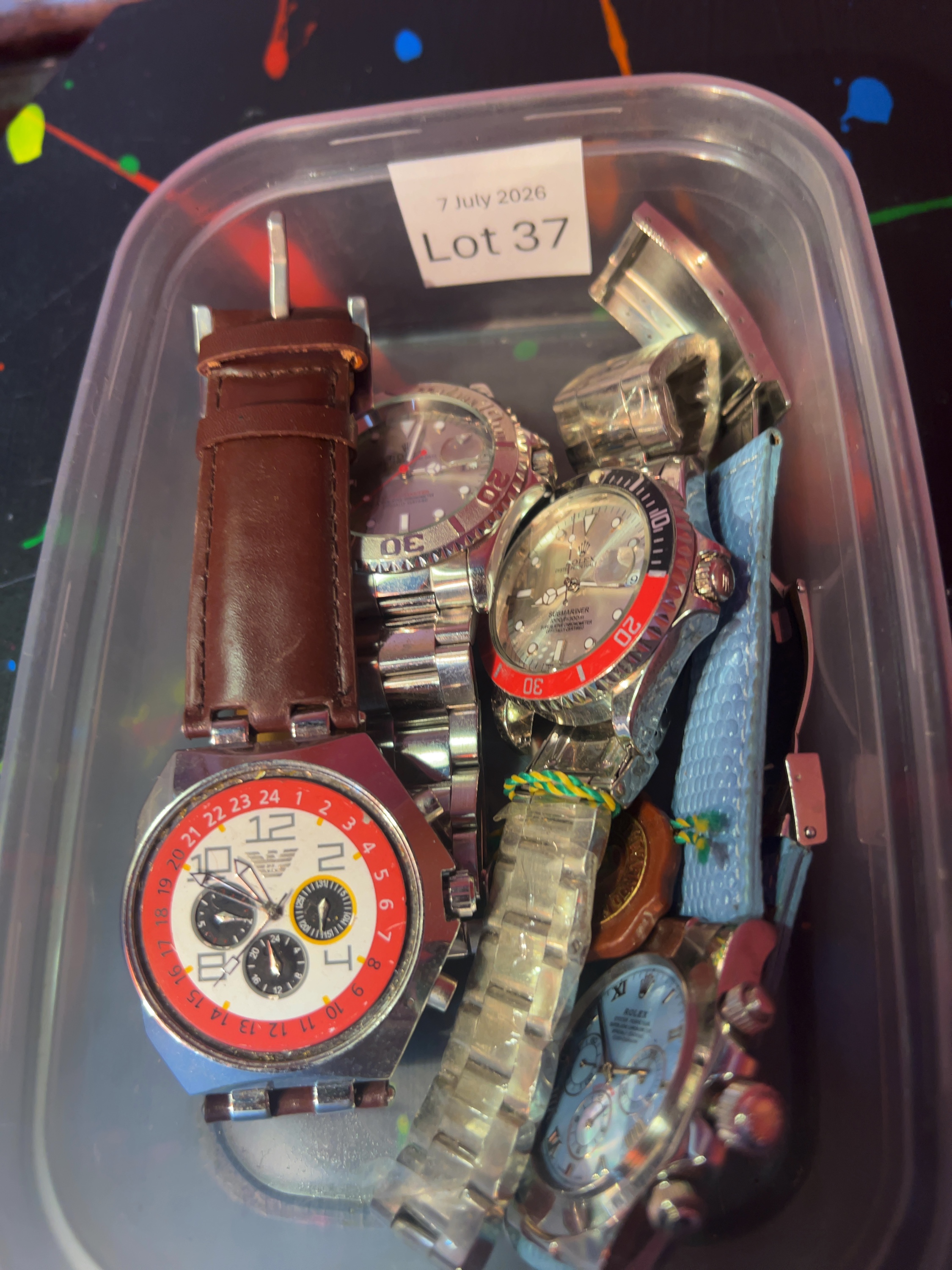 A Collection of Four Assorted Wristwatches bearing Luxury Brand Markings