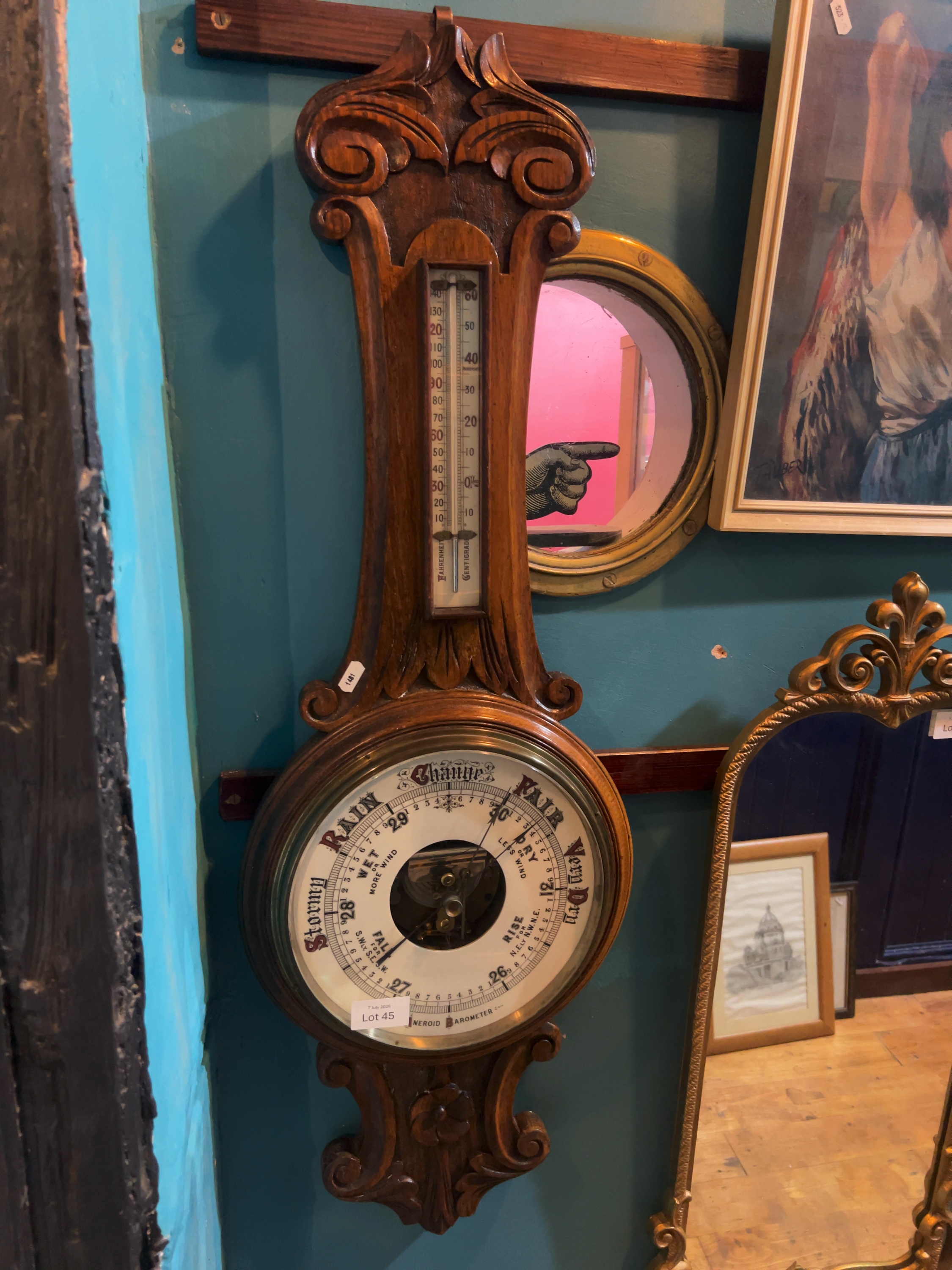 Late Victorian carved oak banjo-form aneroid barometer