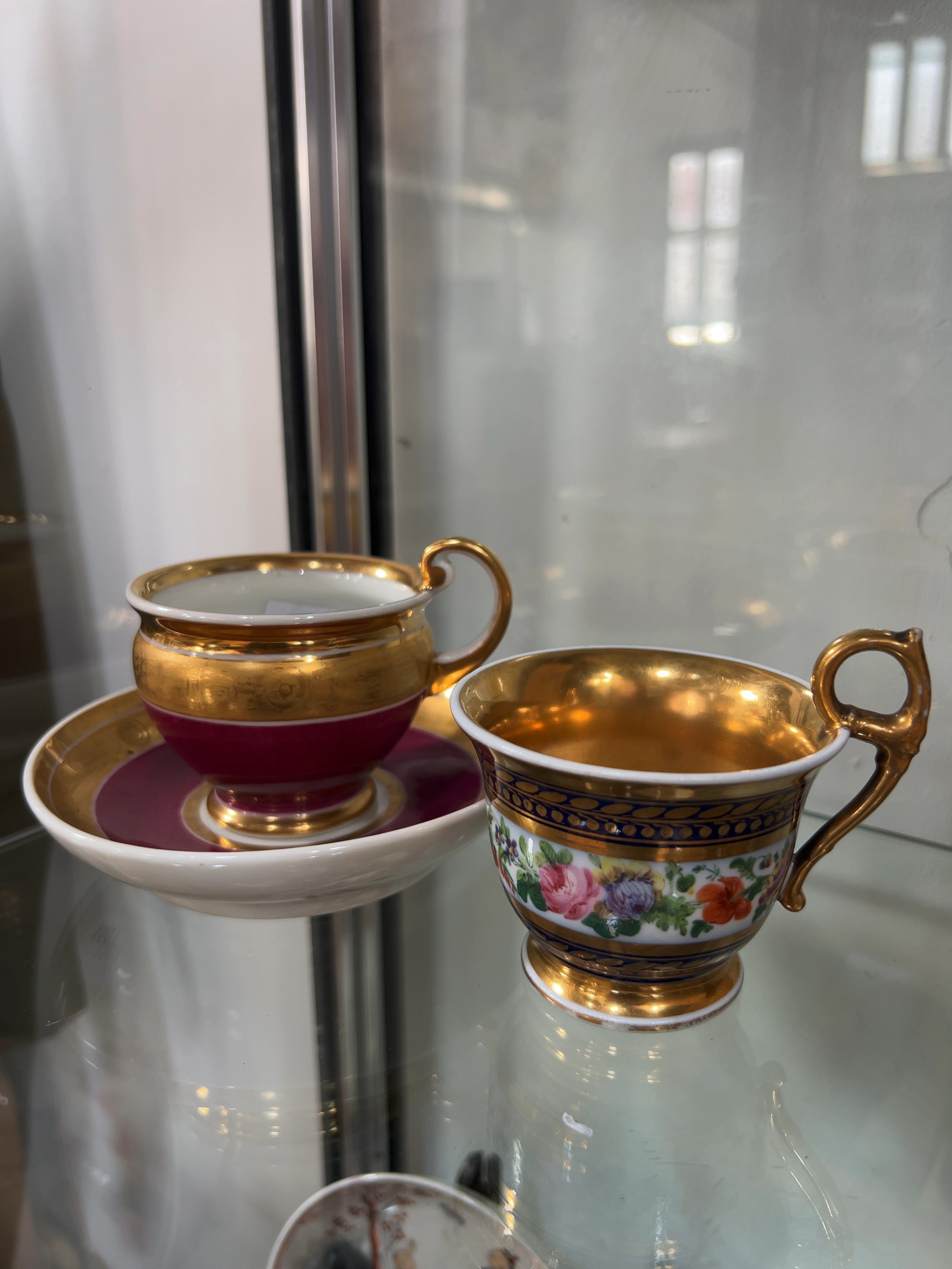 A Collection of Two 19th-Century Porcelain Coffee Cups and One Matching Saucer