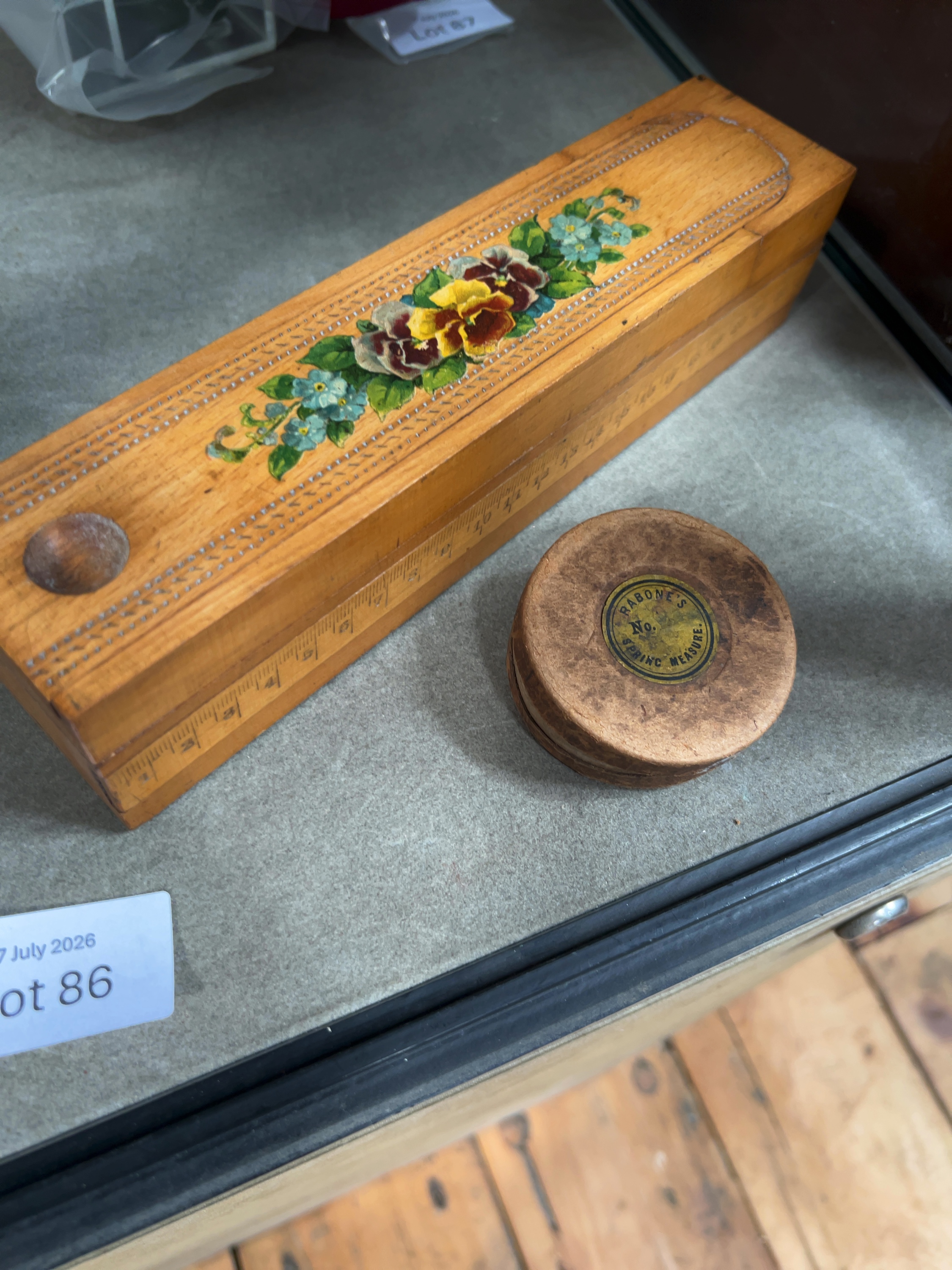 Two Vintage Items: A Decorated Wooden Pencil Box and a Rabone's Standard Bowl Measure