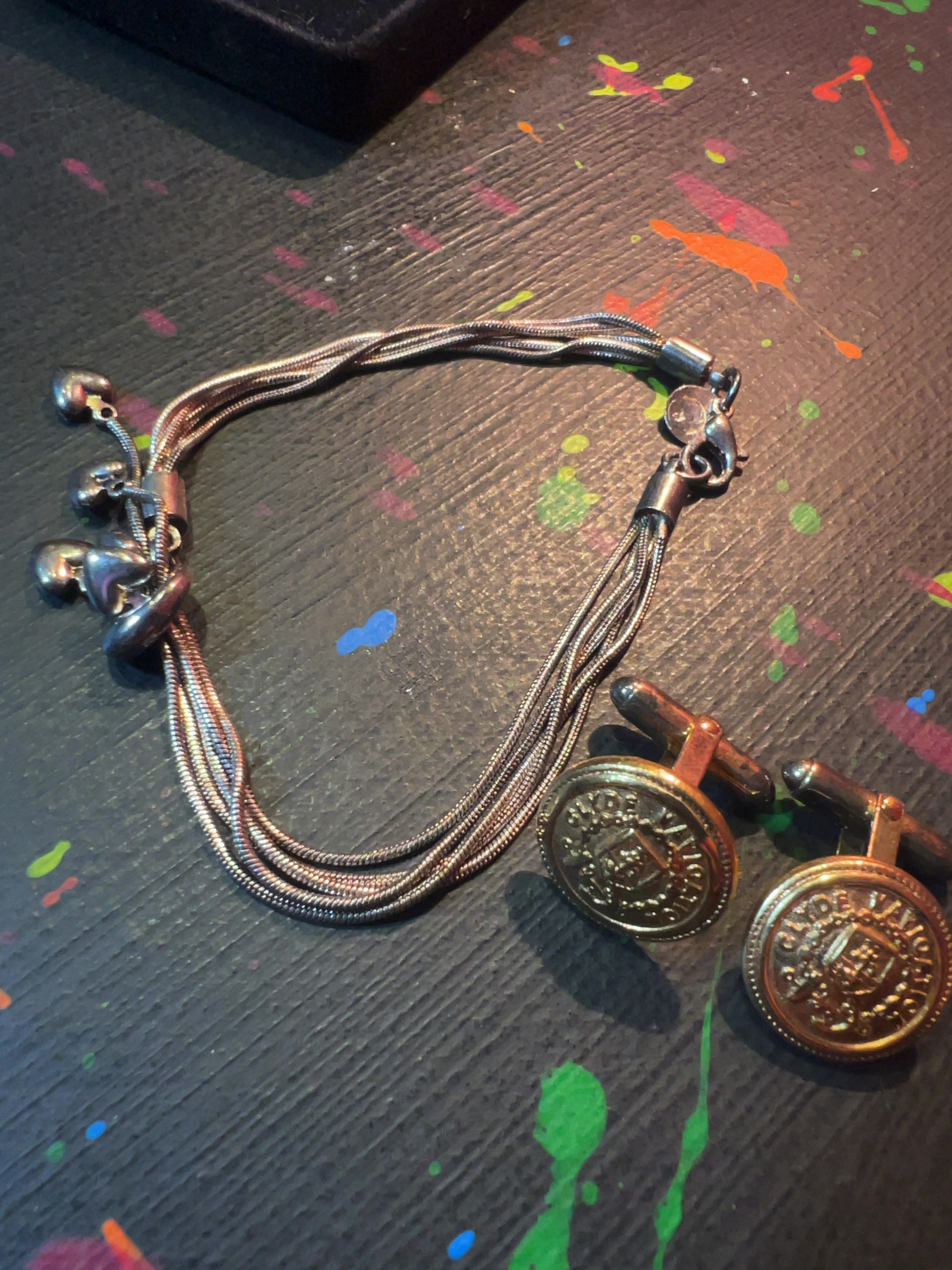A Trio of Jewellery Items comprising a Guess Multi-Strand Charm Bracelet and a Pair of Clyde Navigation Trust Cufflinks