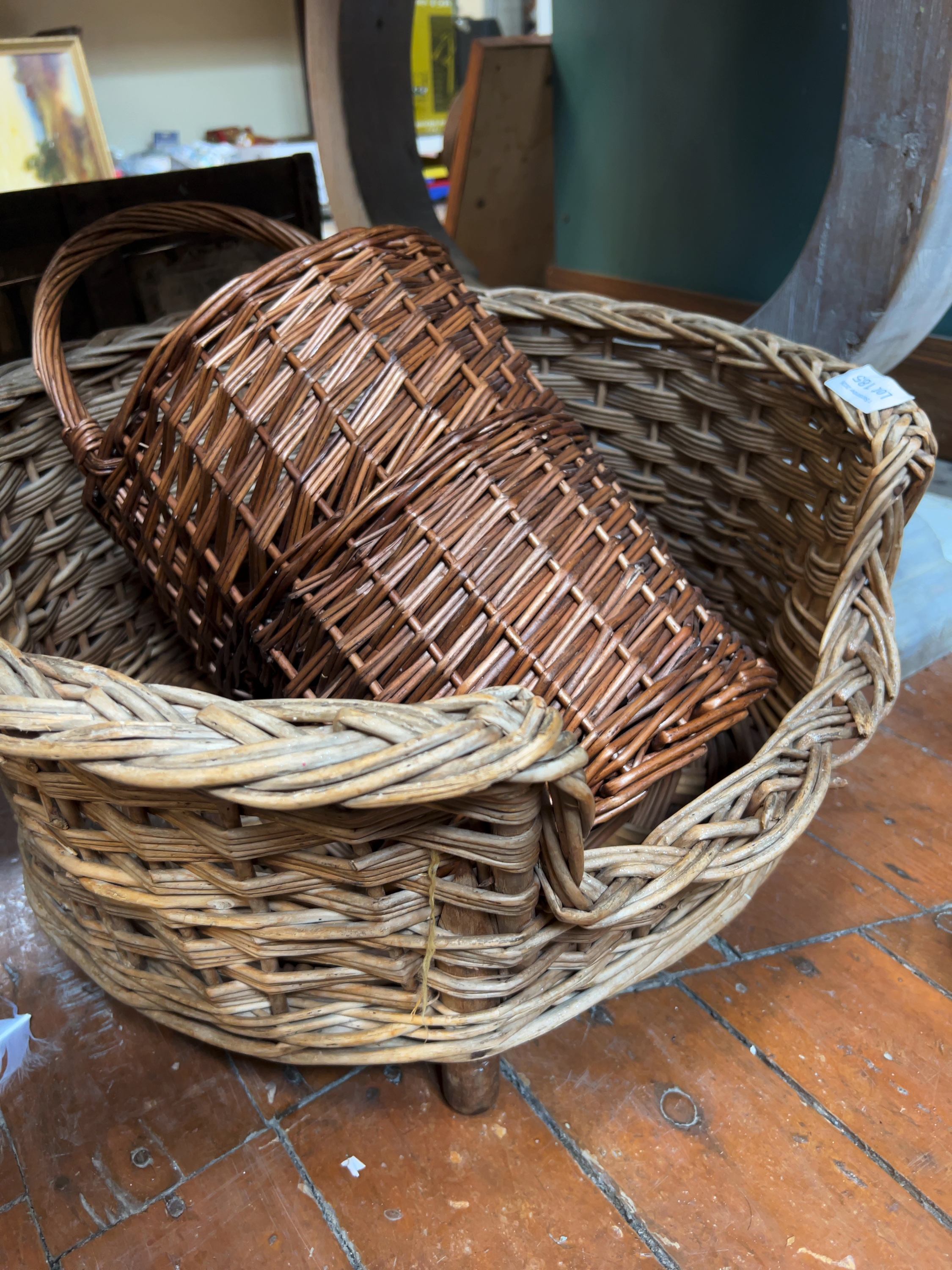 Two Vintage Woven Wicker Baskets Including a Stair Basket