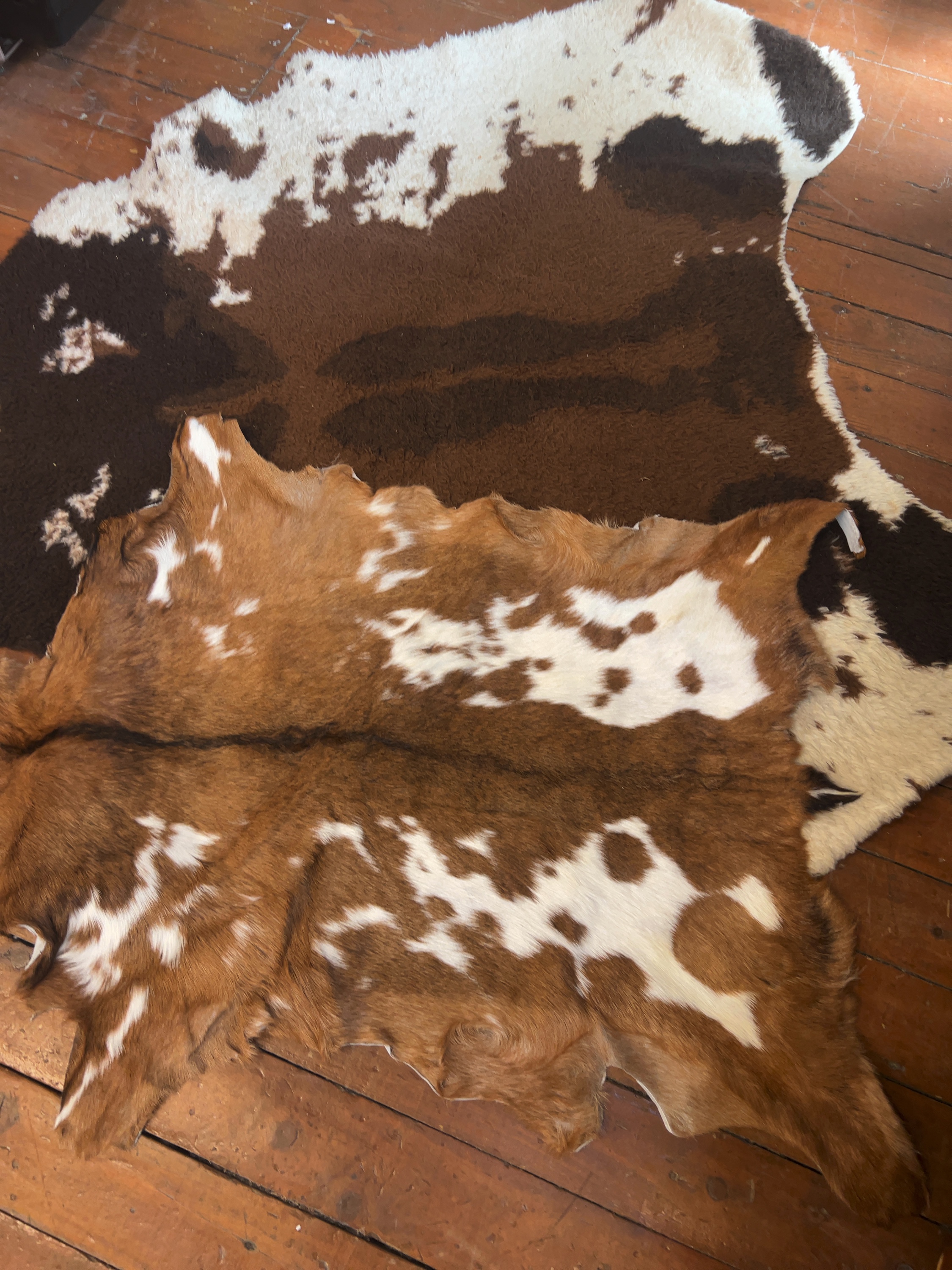 Two Natural Hide Rugs