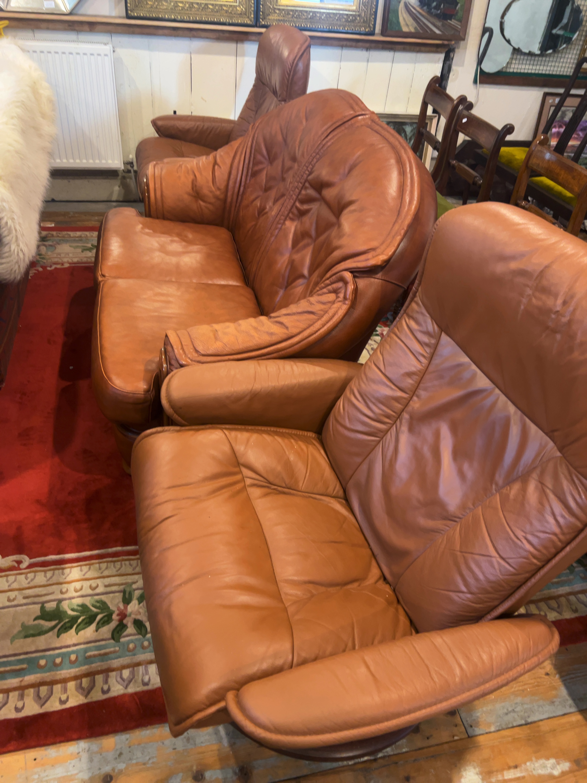 Two Contemporary Ekornes Stressless Cognac Leather Pieces including Reclining Armchair and Sofa