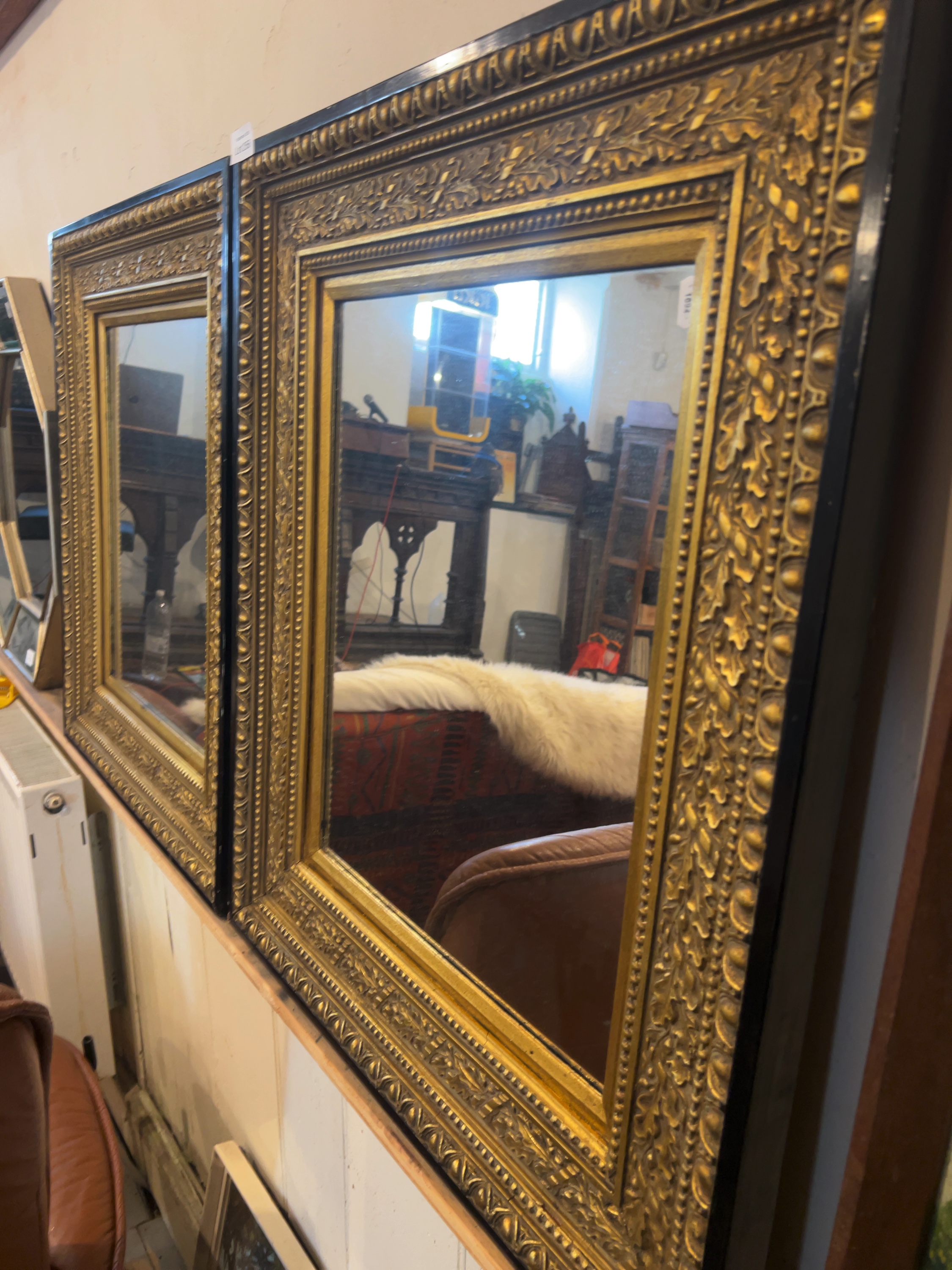 Two Classical Revival-Style Gilded and Ebonised Wall Mirrors