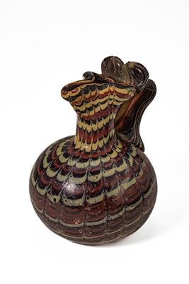 AN ISLAMIC, POSSIBLY FATIMID MARVERED GLASS JUG. Probably North Africa, or Egypt, Ca. 11th - 