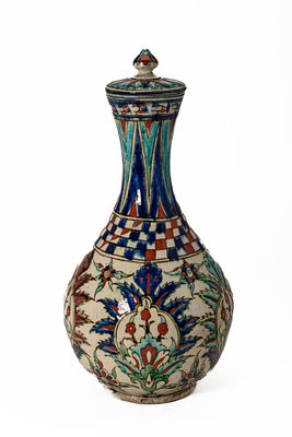 A LIDDED K&Uuml;TAHYA POTTERY VASE. Turkey, Ca. Early 19th century AD. A pottery vase of elegant 