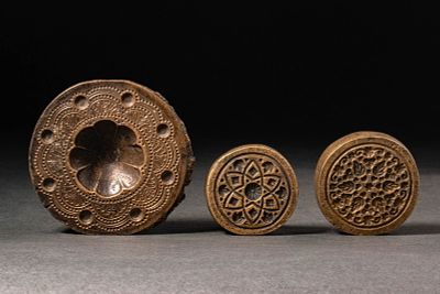 A GROUP OF THREE OTTOMAN BRASS MOULDS, OR WEIGHTS. Ottoman, Turkey, Ca. 18th-19th century AD. A 