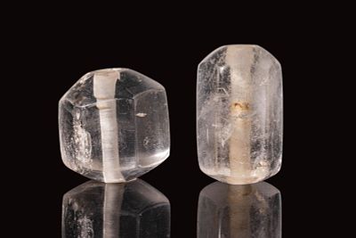 A PAIR OF LARGE EARLY ISLAMIC ROCK CRYSTAL BEADS OR VESSEL STOPPERS. Ca. 12th - 13th century AD. 