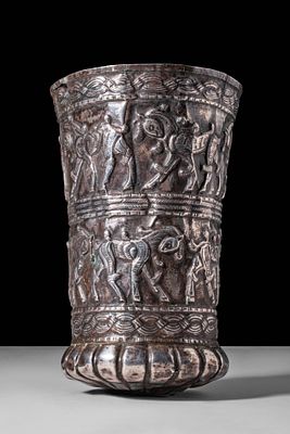 ELAMITE SILVER BEAKER WITH FRIEZES OF HORSES. Ca. 1200 - 900 BC. A silver beaker with a flaring 