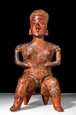 NAYARIT LARGE SEATED FEMALE. Ca. 100 BC - 250 AD. A large reddish, orangeware pottery female 