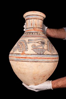 EGYPTIAN POLYCHROME POTTERY JAR WITH WEDJAT EYES AND ANKH SYMBOLS. New Kingdom, Ca. 1550 - 1069 