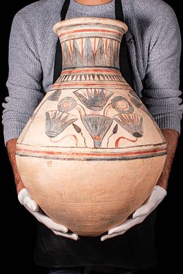 EGYPTIAN PAINTED POTTERY JAR WITH LOTUS FLOWERS, PAPYRUS STEMS AND ANKHS. New Kingdom, Ca. 1550 