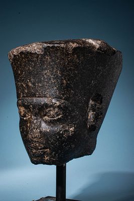 EGYPTIAN GRANODIORITE HEAD OF THE GOD AMUN WITH THE FEATURES OF KING TUTANKHAMUN. Late 18th 