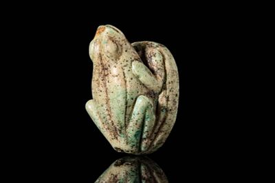 LARGE EGYPTIAN FAIENCE FROG AMULET. Ca. 664 - 30 BC. A pale green faience amulet in the form of 