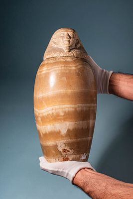 RARE EGYPTIAN ALABASTER CANOPIC JAR WITH HUMAN-HEADED LID (IMSETY). Late Period, probably 26th 
