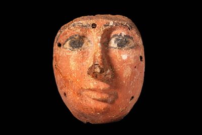 EGYPTIAN SARCOPHAGUS MASK. Late Period, Ca. 664 - 30 BC. A wooden sarcophagus mask carved in 