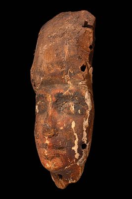 EGYPTIAN WOODEN MUMMY MASK. New Kingdom, Ca. 1550 - 1069 BC. A wooden mummy mask with a narrow 