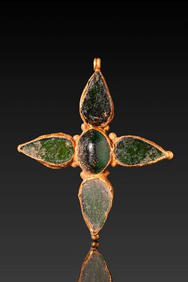 FRANKISH HIGH KARAT GOLD CROSS WITH GREEN GLASS CABOCHONS AND MONOGRAM. Ca. AD 600 - 800. A gold 