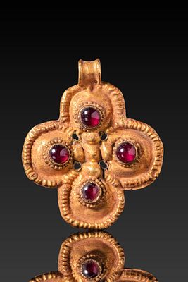 BYZANTINE HIGH KARAT GOLD CROSS PENDANT WITH RED GARNET CABOCHONS. Ca . AD 600 . A 20.5 kt gold 
