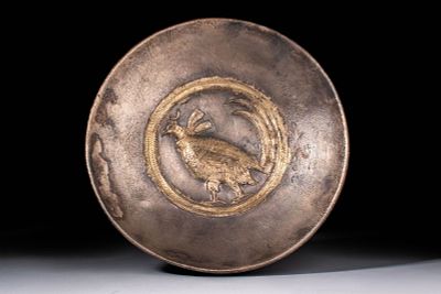 SASANIAN SILVER-GILT SHALLOW BOWL WITH PHEASANT. Ca. AD 400 - 600. A shallow silver bowl with 