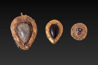 COLLECTION OF MEROVINGIAN HIGH KARAT GOLD PENDANTS WITH CABOCHONS. Ca. AD 400 - 600. A 