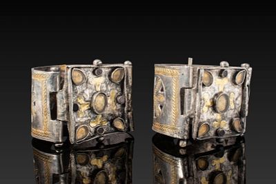 PAIR OF SILVER-GILT BYZANTINE BRACELETS WITH CROSS AND GLASS CABOCHONS. Ca. AD 600. A pair of 