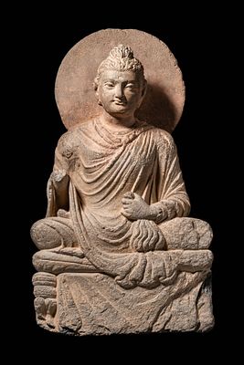 GANDHARAN STONE RELIEF OF SEATED BUDDHA. Ca. AD 300 - 400. A serene depiction of the Buddha 
