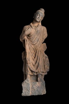 GANDHARAN STONE FIGURE OF BUDDHA. Kushan period. A stone carved figure of Buddha, shown standing 