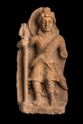 GANDHARAN STONE FIGURE OF A GUARDIAN. Ca. AD 200 - 300. A stone figure of a guardian, standing 