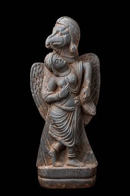 GANDHARAN STONE CARVING OF GARUDA ABDUCTING QUEEN KAKATI. Ca. AD 300 or later. A carved grey 