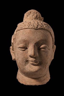 STONE HEAD OF BUDDHA. Ca. 30 BC - AD 375, Kushan Period or later. A carved head of Buddha in 