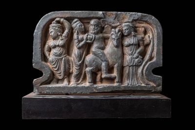 GANDHARAN PANEL DEPICTING RIDER AND ATTENDANTS. Ca. AD 200 or later. A schist panel carved in 