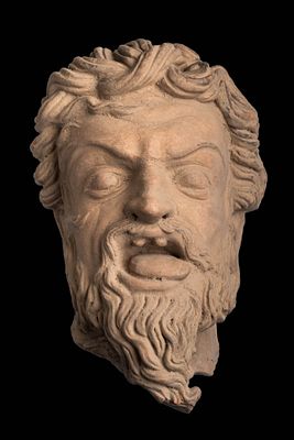 GANDHARAN STONE HEAD OF YAKSA MARA PUTRA. Ca. 100 BC - AD 100. A striking terracotta head from 