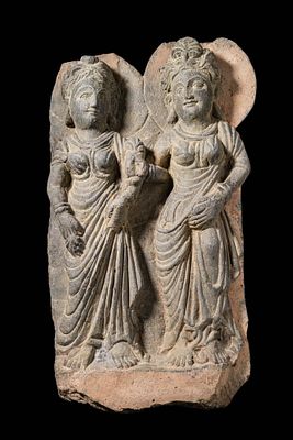GANDHARAN STONE RELIEF OF TWO FEMALE ATTENDANTS. Ca. AD 300 - 400. A finely carved schist relief 