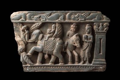 GANDHARAN STONE PANEL DEPICTING PROCESSION SCENE. Ca. AD 200 or later. A stone panel carved in 