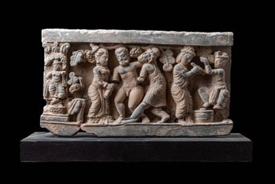 GANDHARAN STONE PANEL DEPICTING THE DRUNKEN HERACLES. Ca. AD 200 - 300. A schist stone panel 