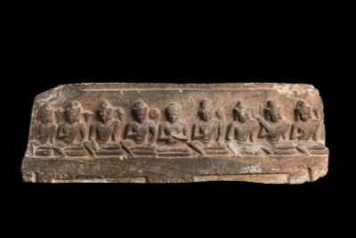 INDIAN STONE PANEL WITH THE TEACHING BUDDHA. Ca. AD 800 - 900. A carved schist panel depicting 