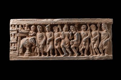GANDHARAN STONE PANEL DEPICTING PROCESSION SCENE. Ca. AD 200 - 300. A stone panel depicting a 