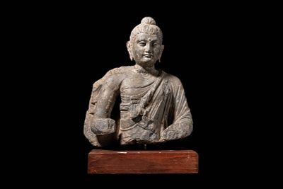 GANDHARAN CARVED STONE TORSO OF BUDDHA. Kushan Period, Ca. AD 200 - 300. A finely carved schist 