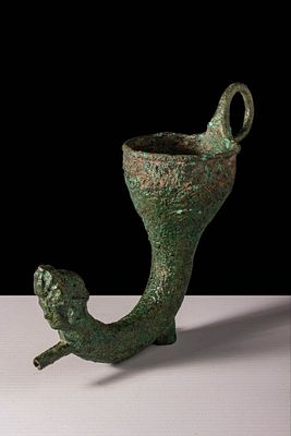 GANDHARAN BRONZE RHYTON WITH GODDESS HEAD. Ca. 100 BC - AD 200. A bronze rhyton cast with a long 