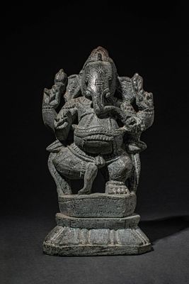 STONE FIGURE OF GANESHA. Ca. 20th century AD. A carved stone figure of Ganesha, the 